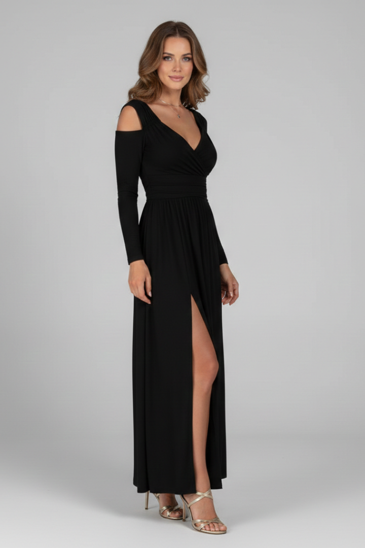 Model side posing in slit dress on gray background