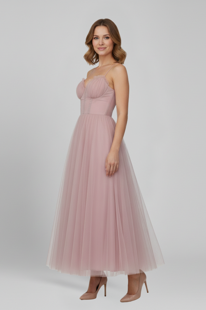 Side angle woman in tulle dress in white background
