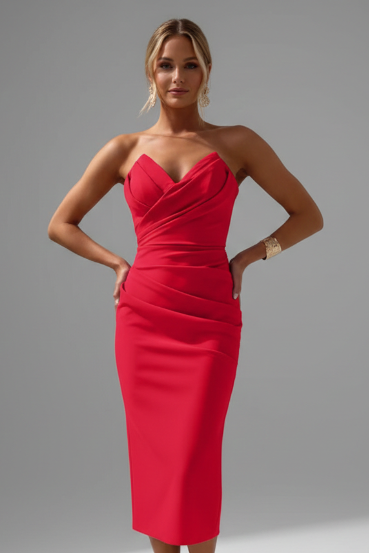 Model wearing sleek evening dress in studio setting
