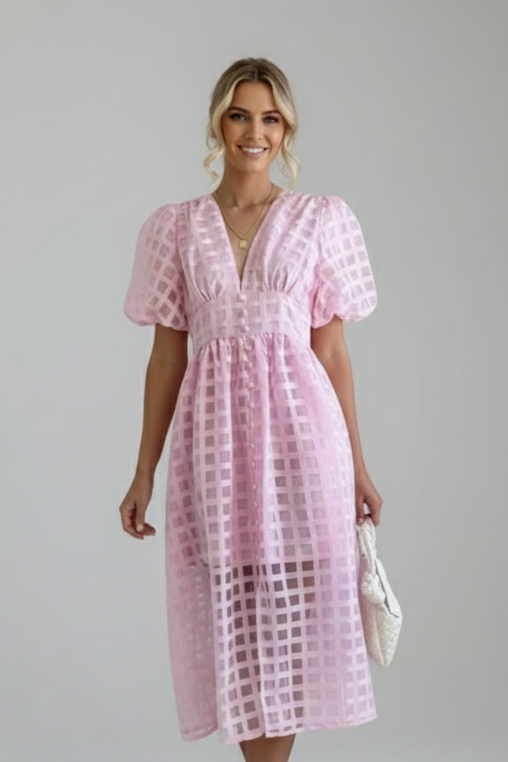 Elegant women’s midi pink dress front shot with model