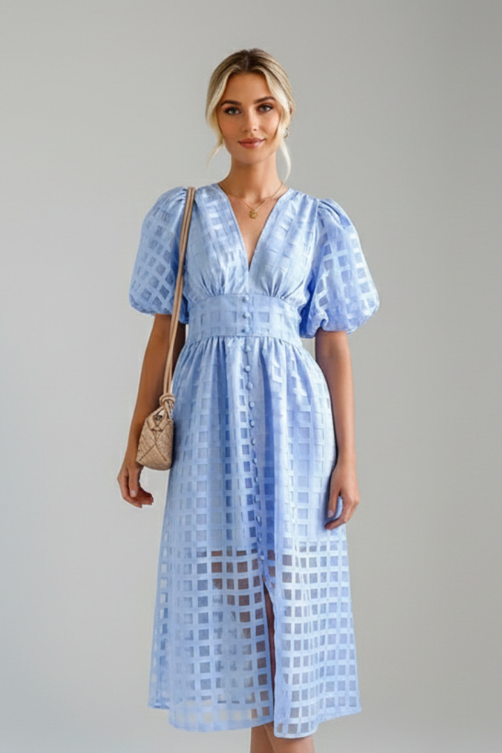 Model showing front profile of midi lace dress
