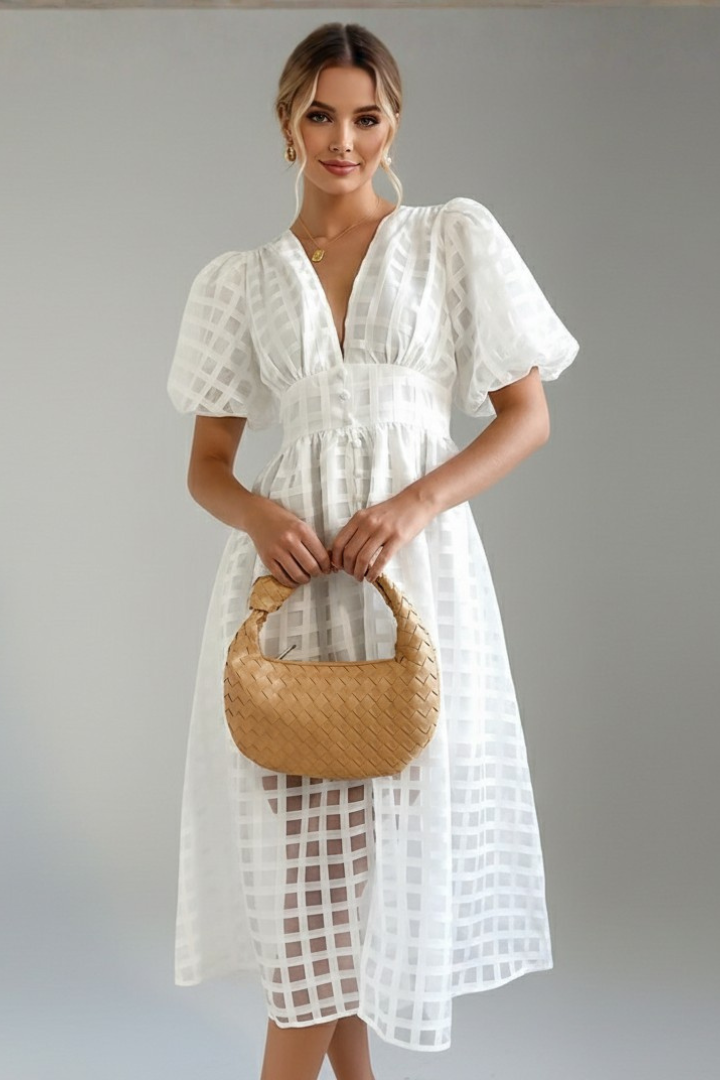 Full length women’s lace white dress worn by model