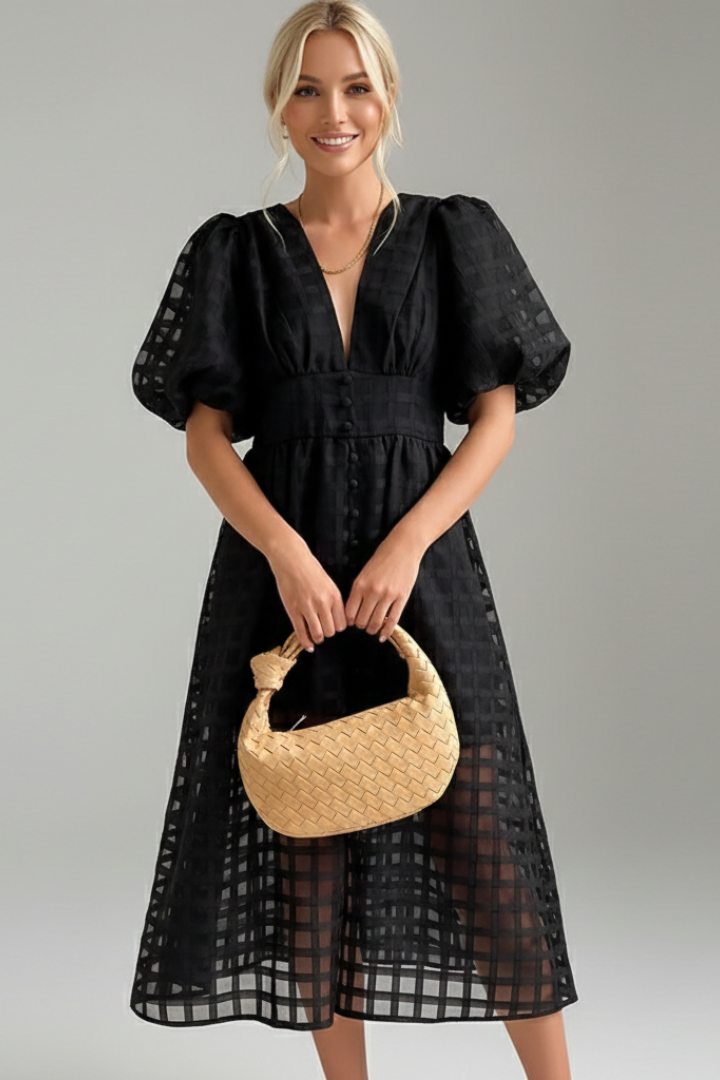 Close front view of lace women’s dress on female model