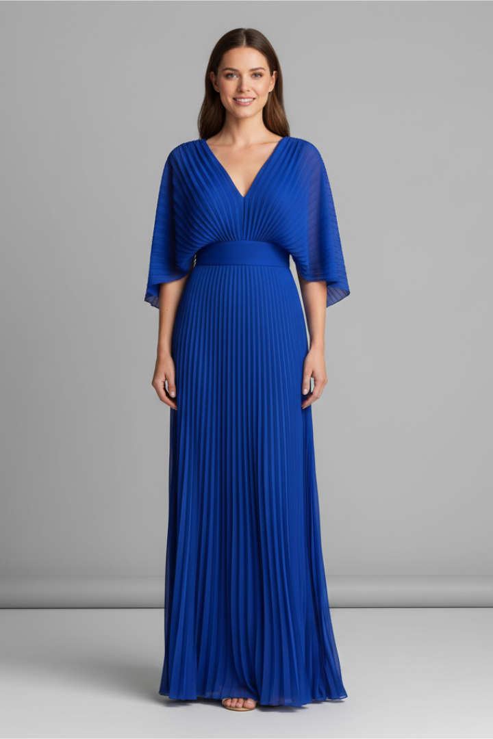 Model wearing pleated long sleeve blue dress gray background 