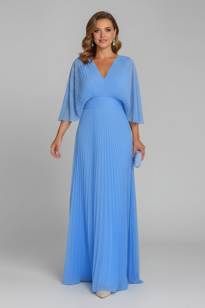 Model showcasing waist seam pleated maxi blue dress