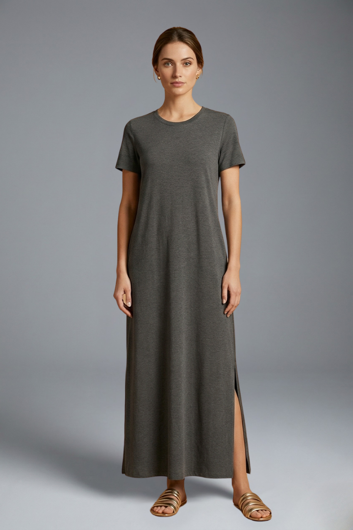 Woman wearing maxi dress on front view gray background