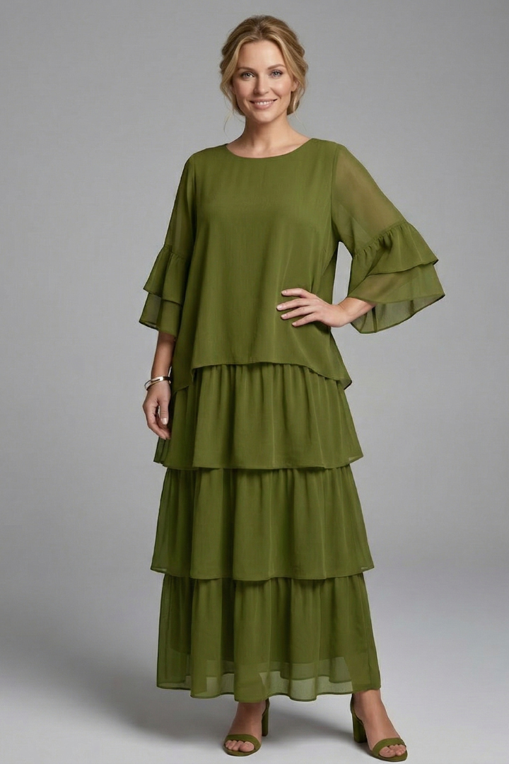 Front angle female model in full front silhouette with layered skirt and sleeves