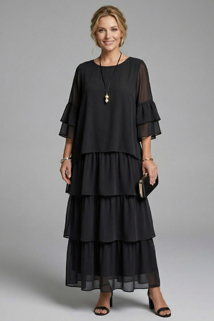 Model wearing loose casual black dress in front view