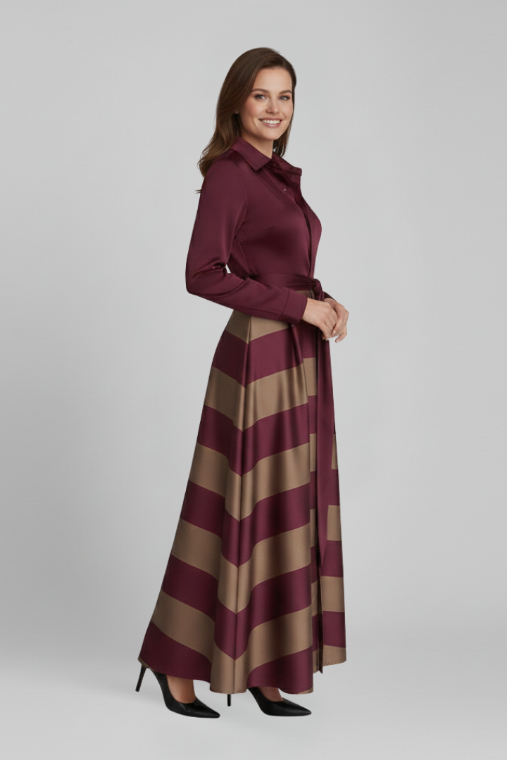 Woman showing button-front maxi dress, standing pose, plain gray background.