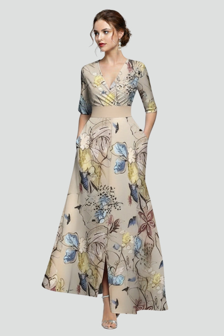 Female model walking pose in maxi dress plain gray background