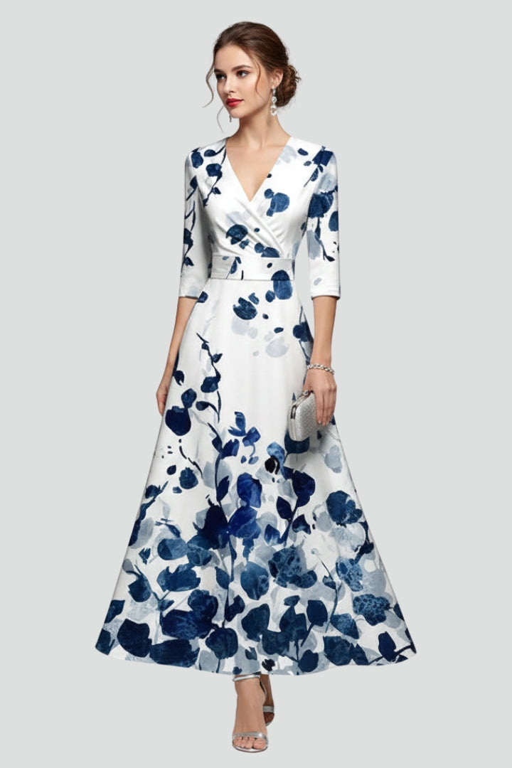 Female model front view wearing floral maxi dress on gray background