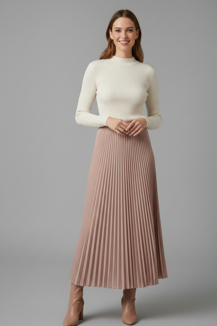 Women smiling wearing pleated long skirt and plain top on white background