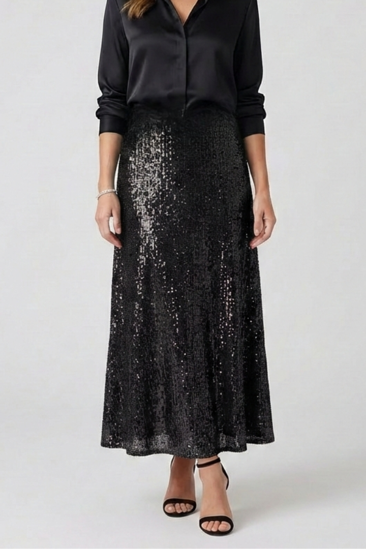 Glamorous woman in all black, skirt and top front angle with gray background