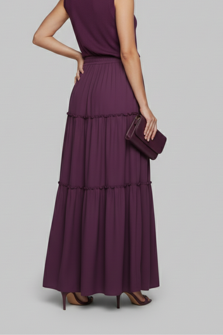 Model back view flowy maxi skirt gray background