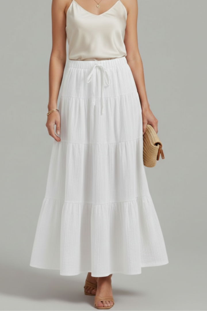 Model in high waist white skirt front view gray background