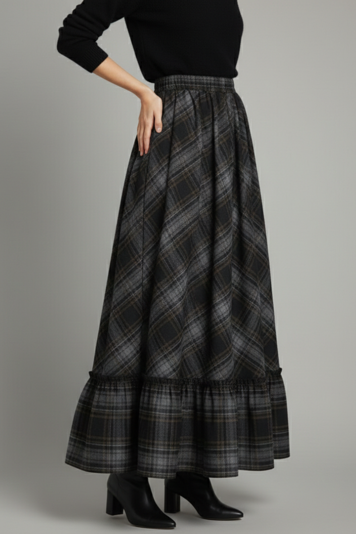 Model showcasing high-waist plaid skirt gray studio backdrop