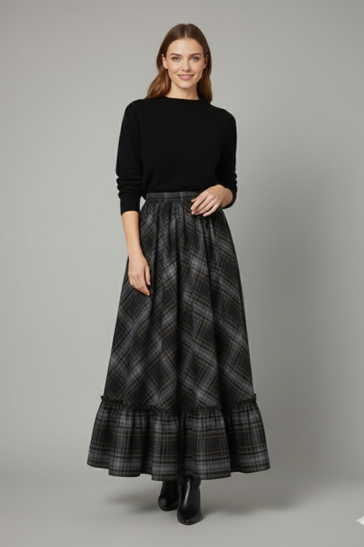 Model wearing plaid maxi skirt front view gray background
