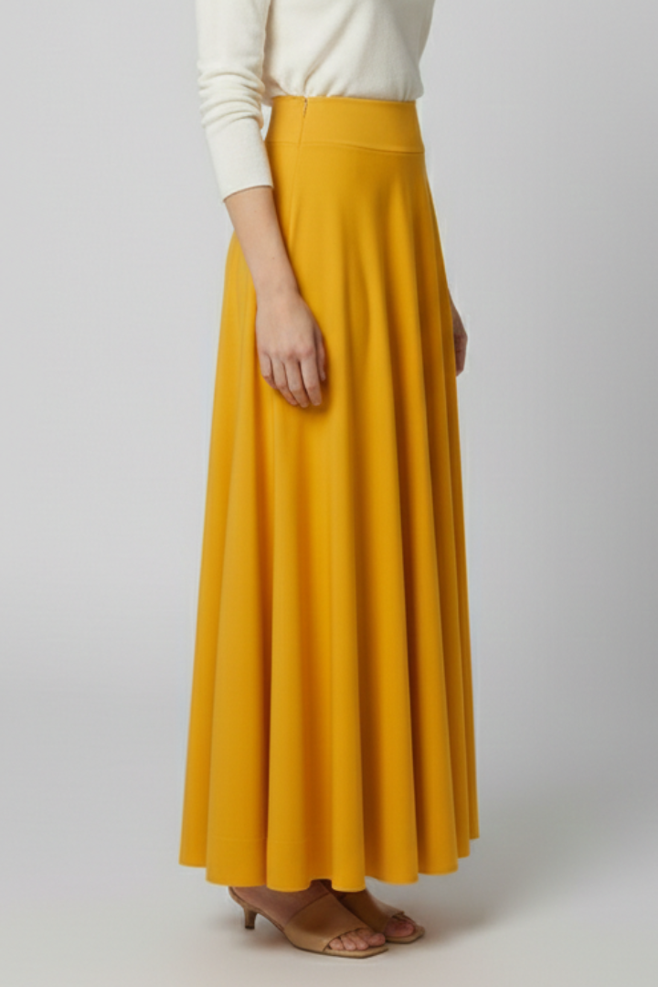 Back view floor length skirt with model and in a plain gray background