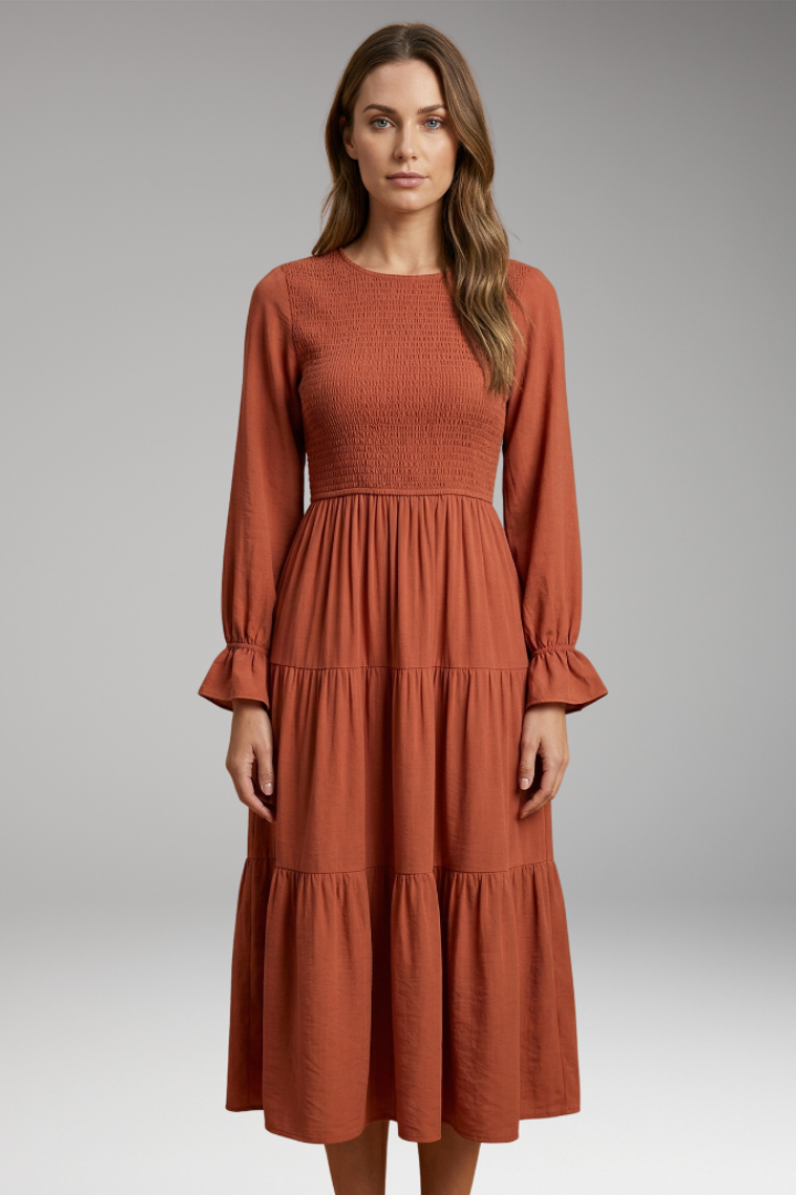 Front view model in rust midi dress on gray background