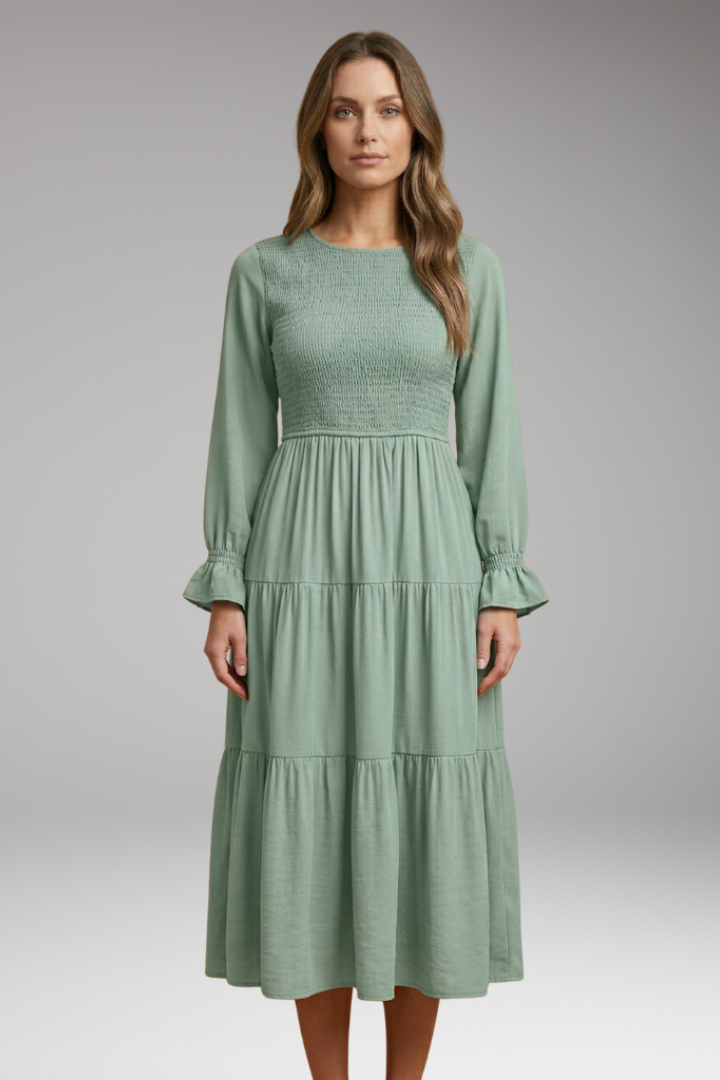 Full front angle flowy long green dress gray backdrop