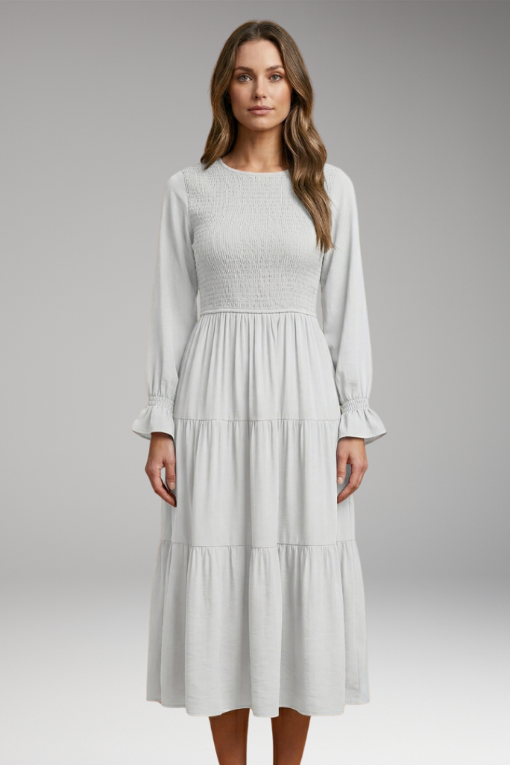 Modest women’s white dress front view clean studio setting