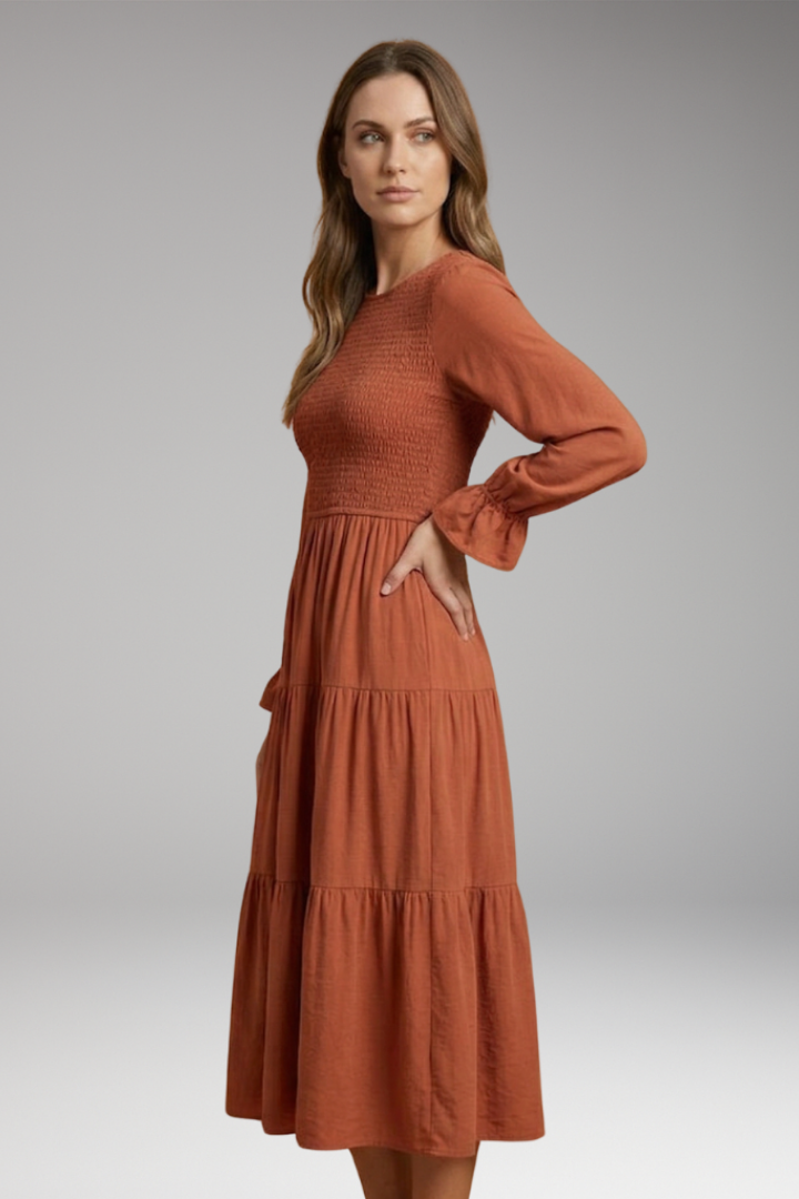 Full length rust dress side pose studio shot