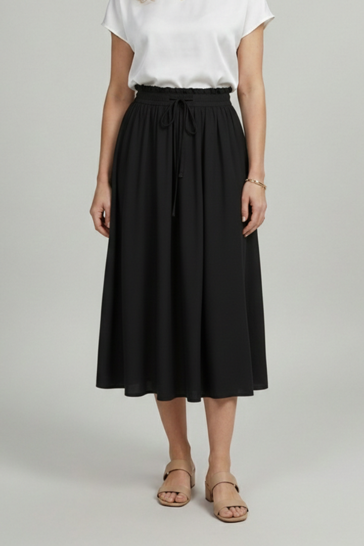Fashionable model in black skirt with gathered waist and drawstring