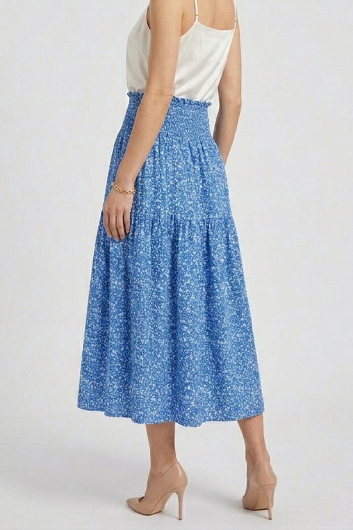 Woman floral skirt straight front angle white backdrop