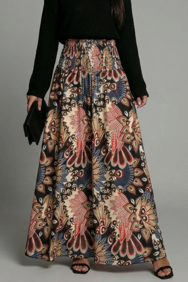 Model in geometric multicolor skirt close-up view with neutral backdrop