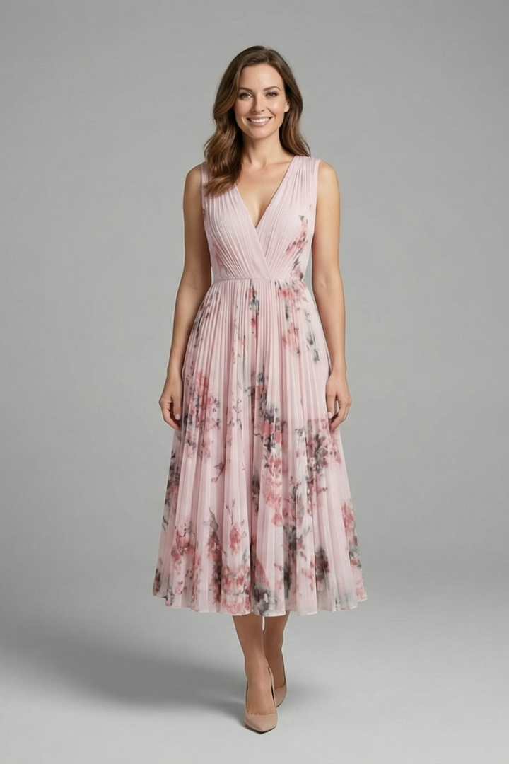 Female front view gray background pleated pink dress
