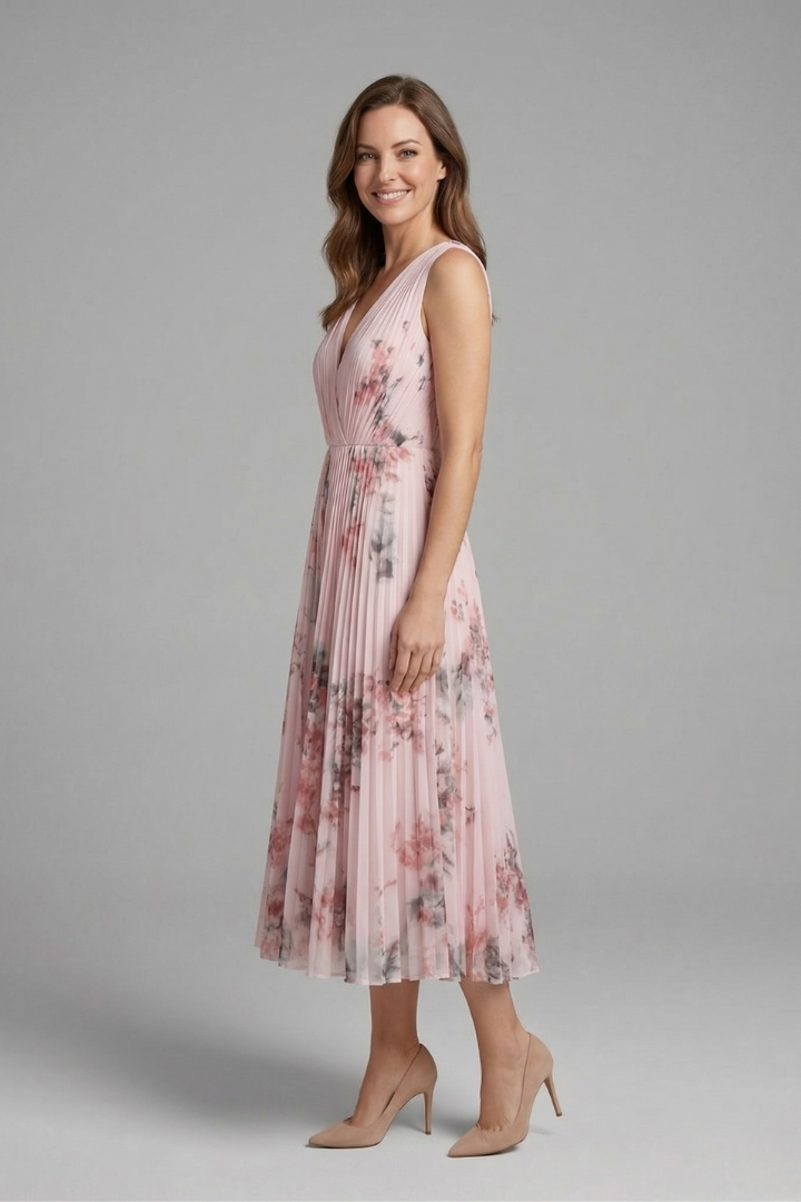 Model side angle gray background sleeveless dress
