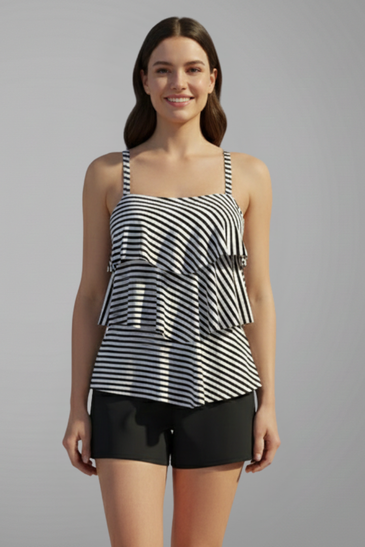 Female model front angle striped swimwear set, plain gray background