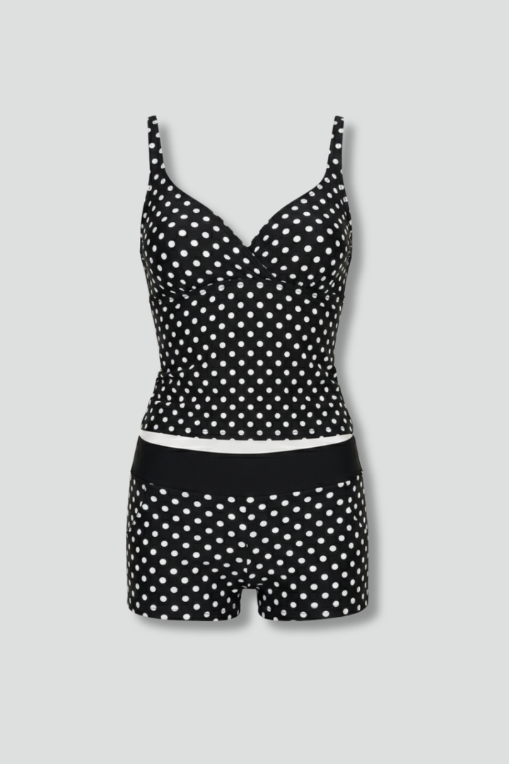 Dotted print tankini set, front view, plain gray background.