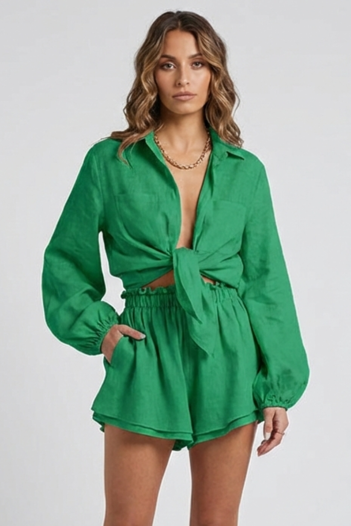 Female model button green shirt front on gray background