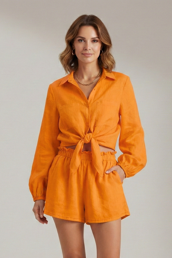 Woman orange full outfit front on gray background