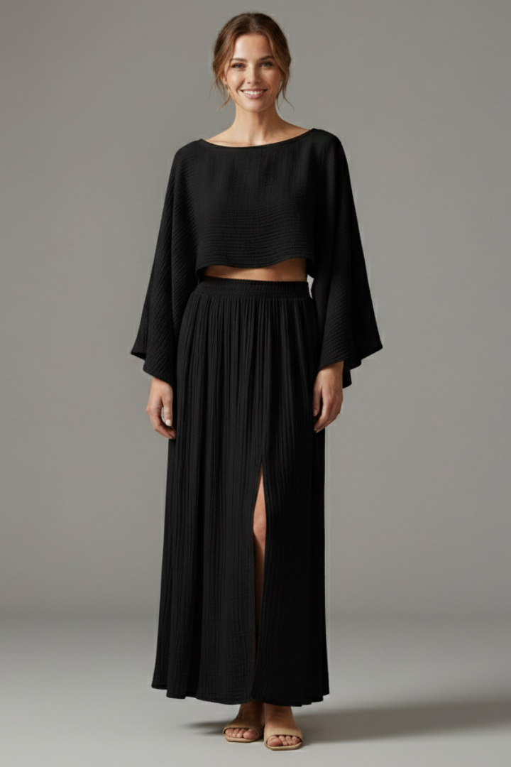 Model displaying matching black outfit in plain background
