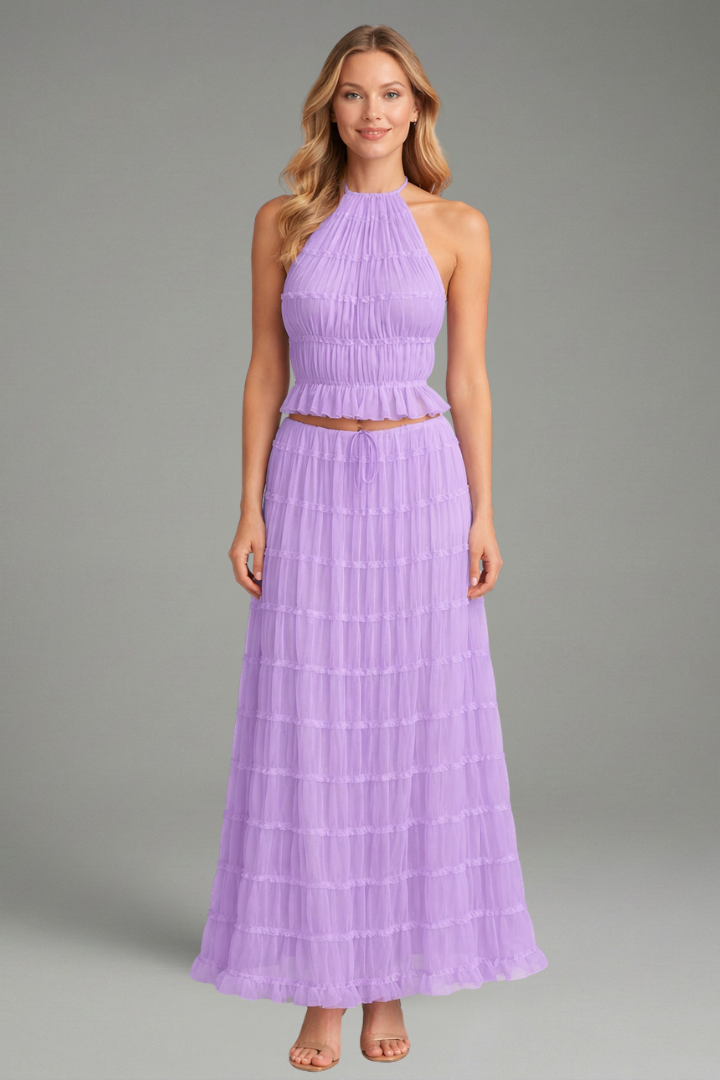 Model long halter top and skirt flow on gray background