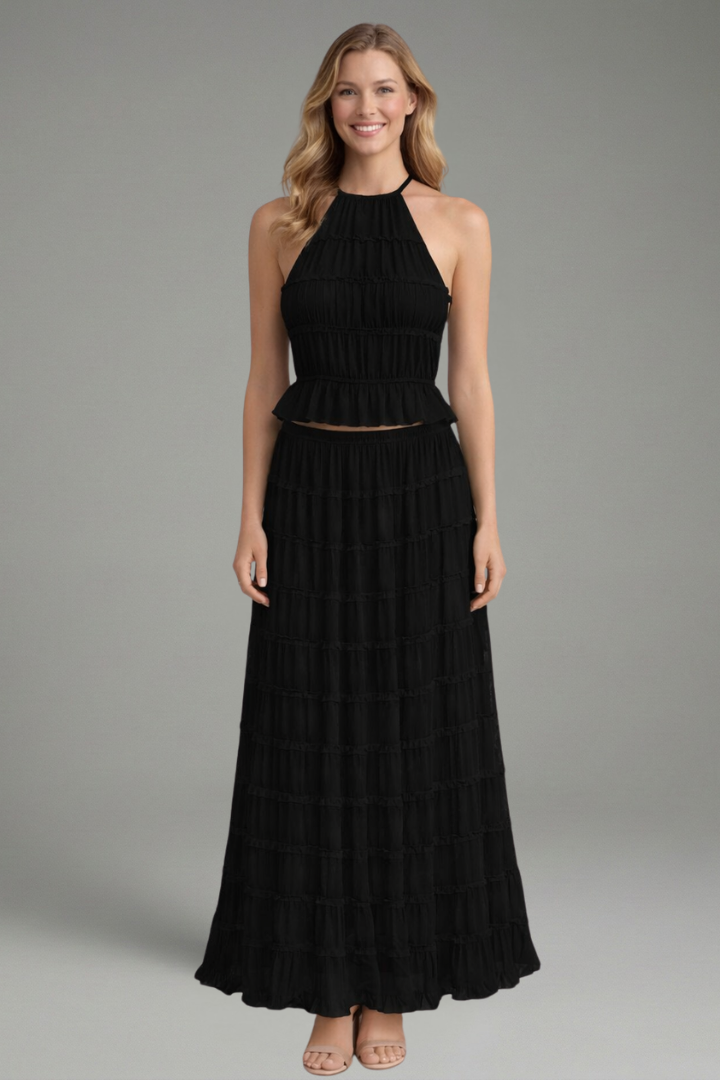 Female model wearing black set detail on gray background