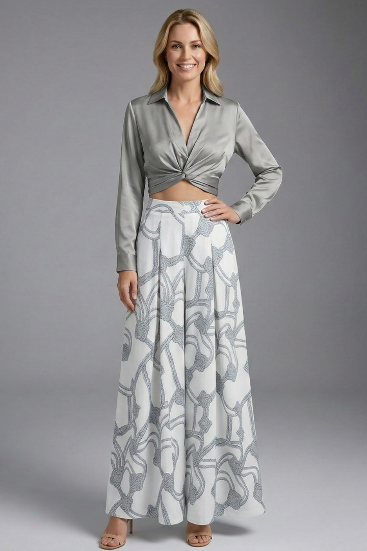 Female model elegant outfit gray set on plain gray background