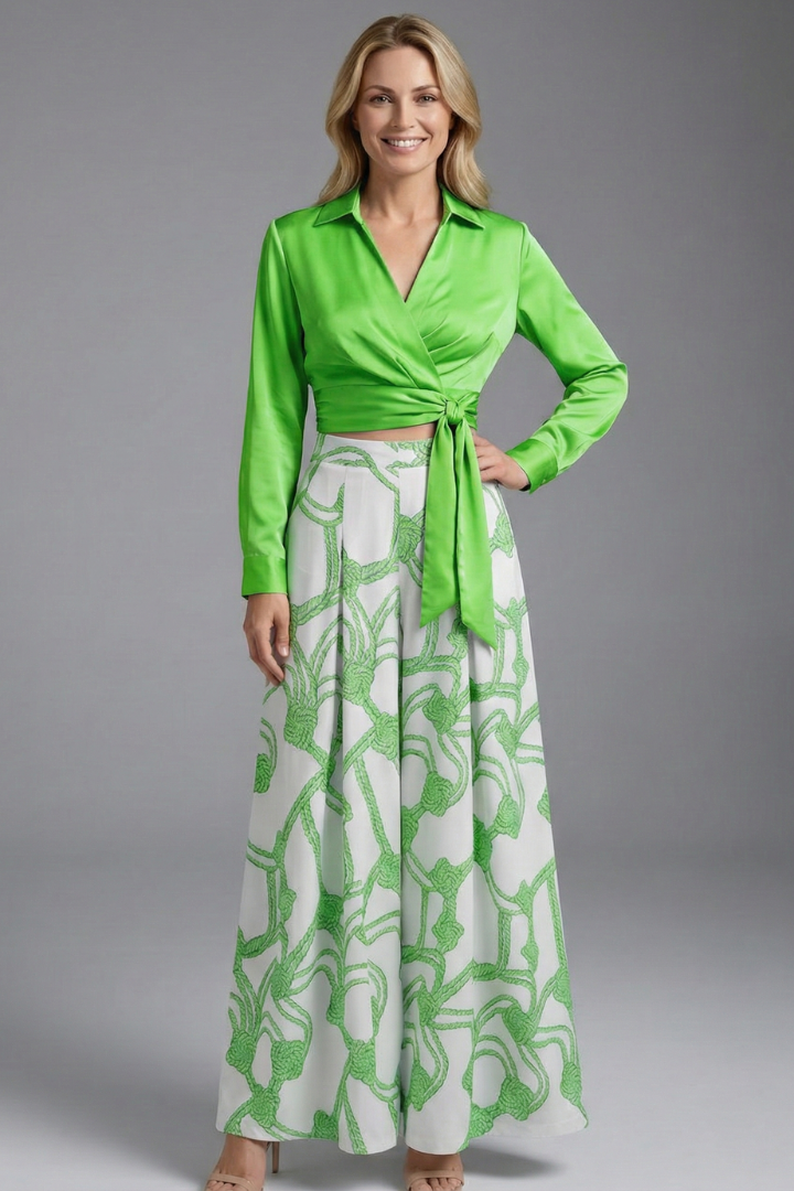 Female model maxi green skirt pose gray background
