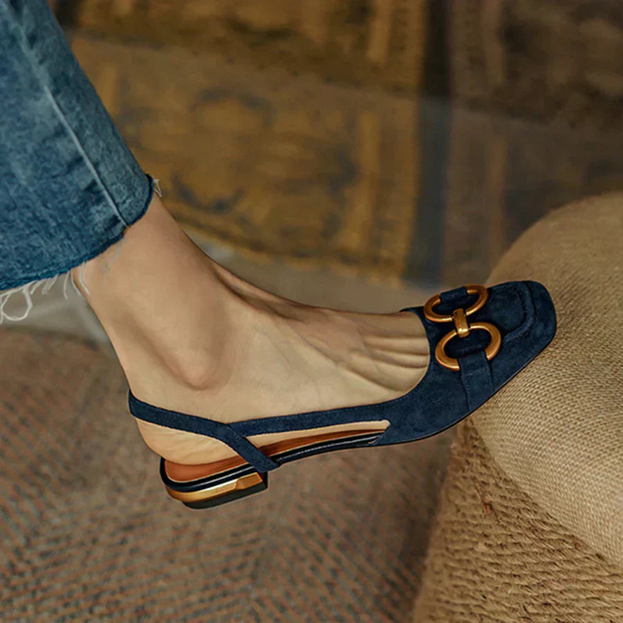Elegant women’s sandal with adjustable buckle strap on a clean background.