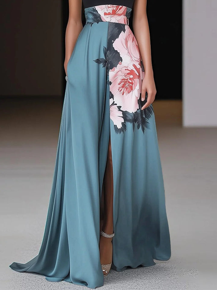 Long floral dress with side slit shown on female model.