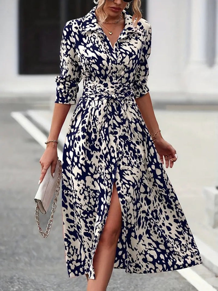 Female in a button-down midi dress with a clean silhouette and relaxed fit.