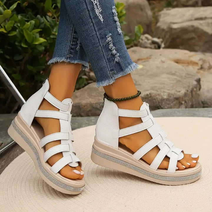 Model feet in breathable supportive sandals with adjustable fit straps.