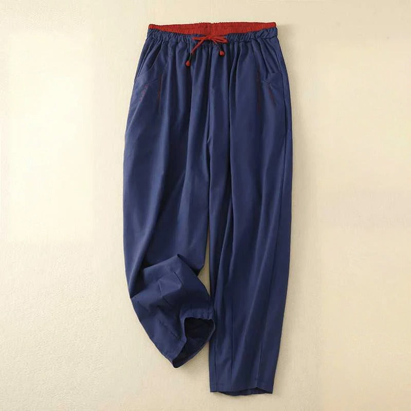 Model wearing airy summer pants with a relaxed fit on a clean background.
