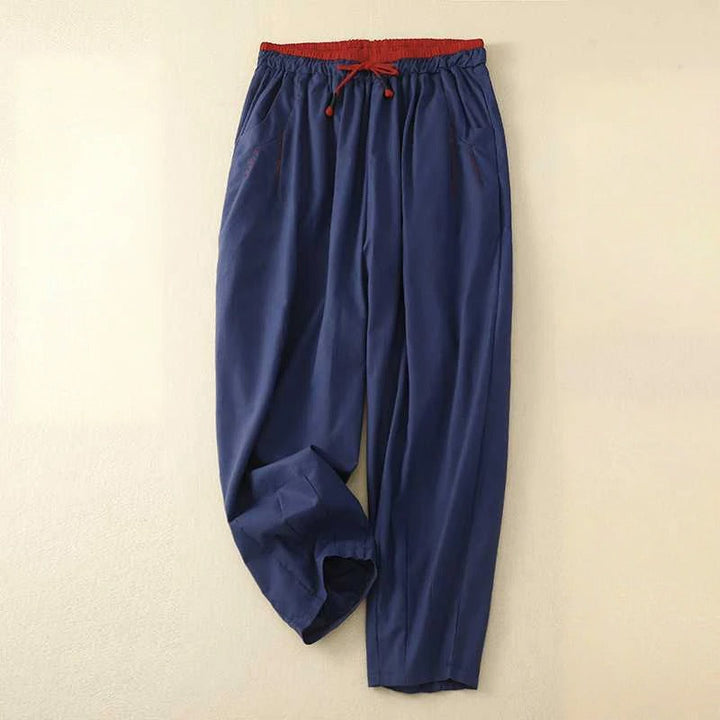 Model wearing airy summer pants with a relaxed fit on a clean background.