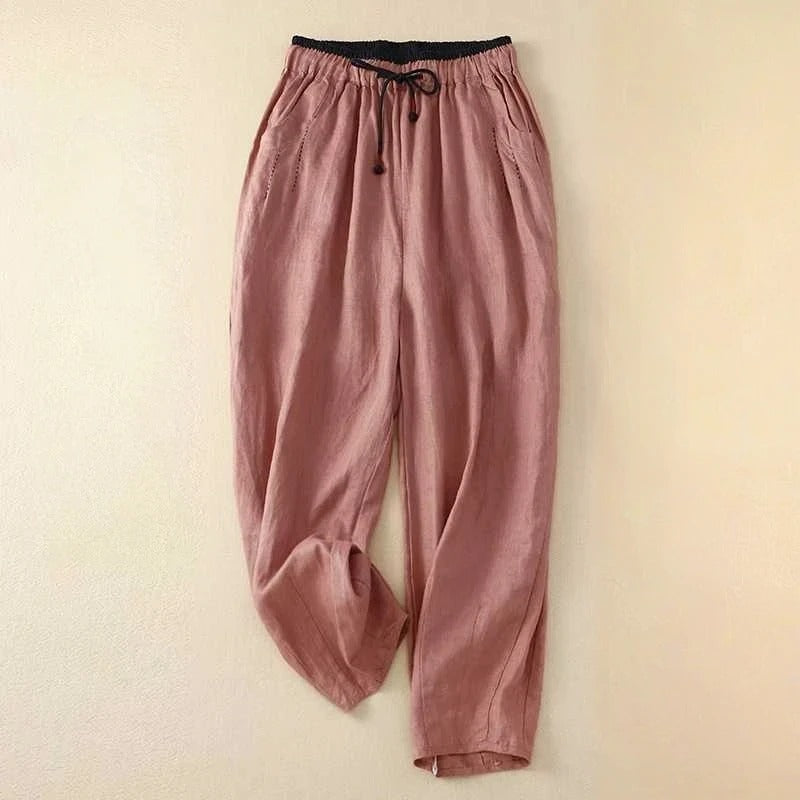 Woman styled in lightweight casual pants against a plain background.
