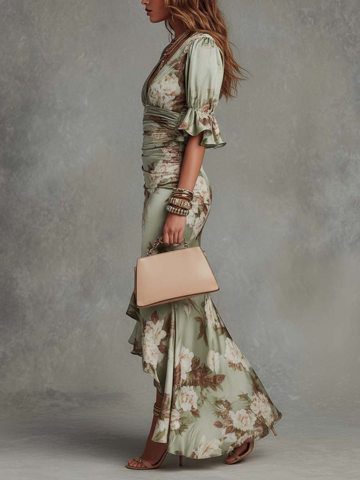 Female modeling a long sleeve floral dress with a flattering silhouette on a plain background.