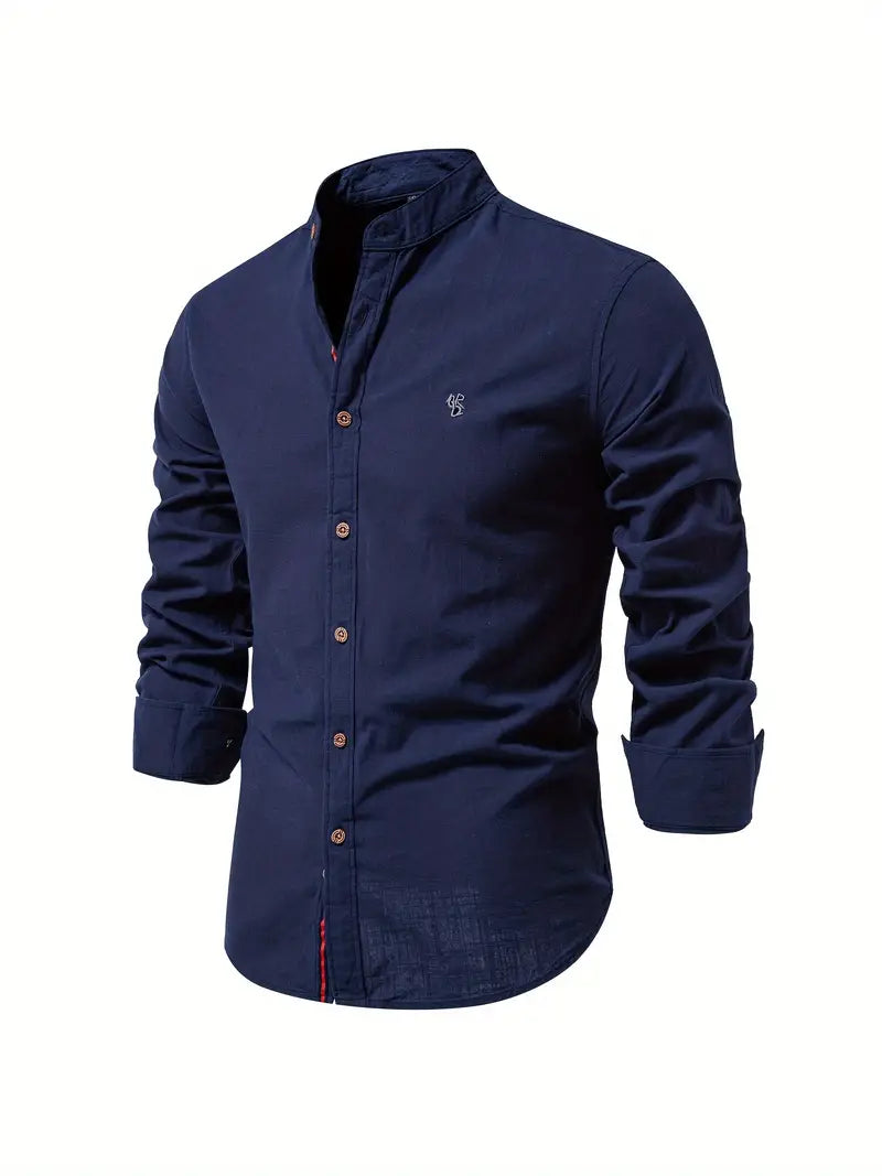 A slim button-up shirt with front closure on a plain background.