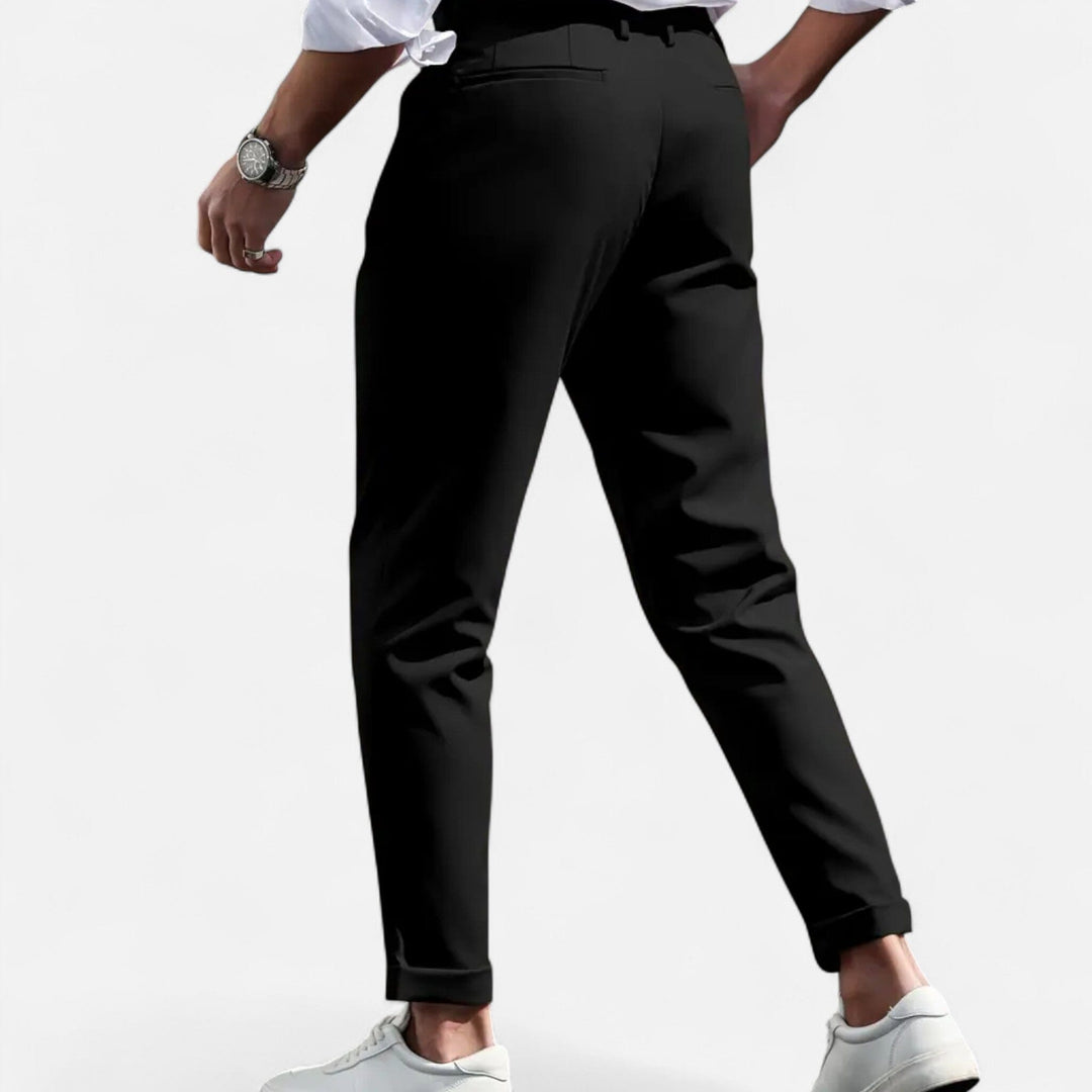  Male model wearing structured slim leg trousers against a plain background.